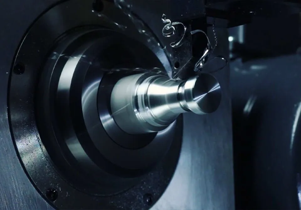 CNC lathe chuck machining a precision steel component